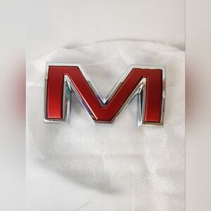 GMC Genuine Part  Red Letter "M" Tailgate Emblem LOGO Part #84237677 NEW